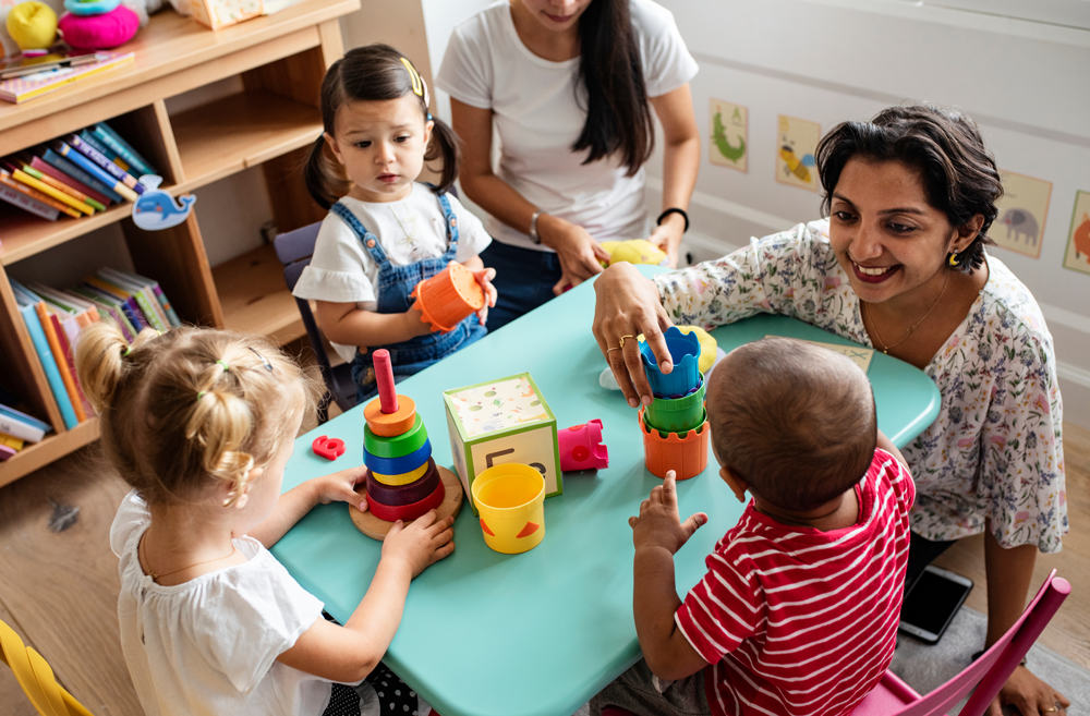 Nursery Teacher with Children