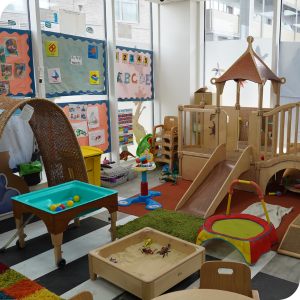 Early Years learning environment with play equipment, sensory activities and educational resources.